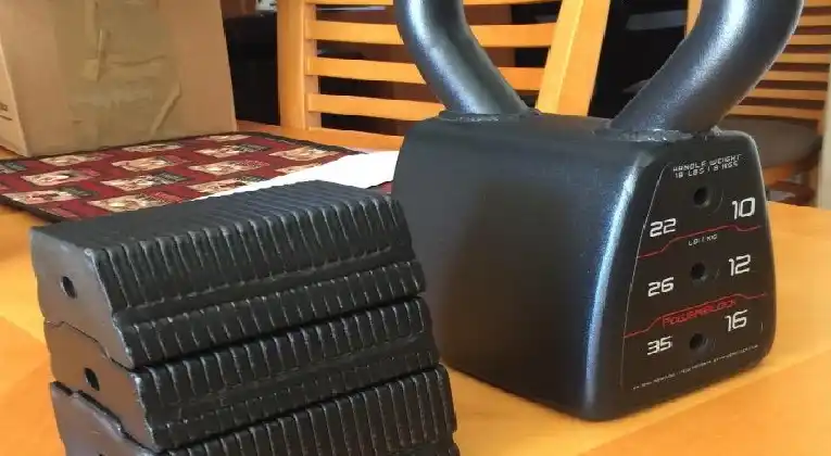a powerblock adjustable kettlebell weight stack and side view of kettlebell